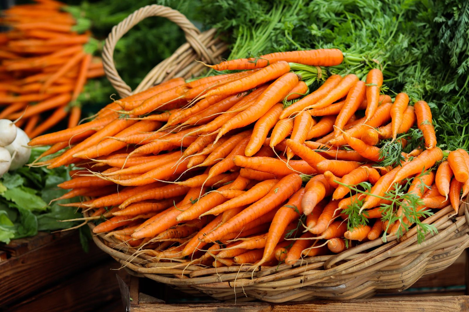 orange carrots on brown woven basket